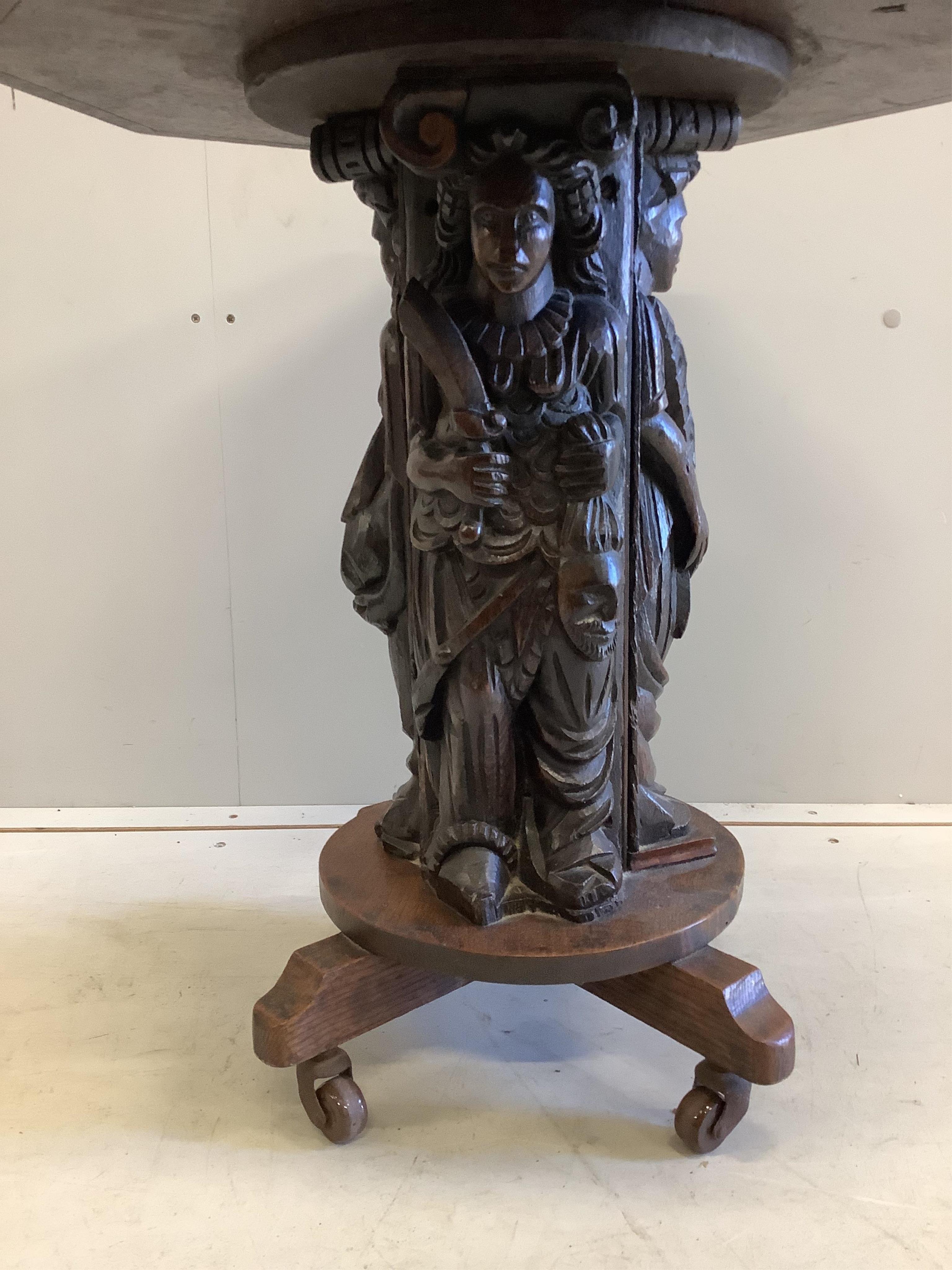 A 19th century octagonal oak side table with figural column, incorporates old timber, width 55cm, depth 55cm, height 59cm